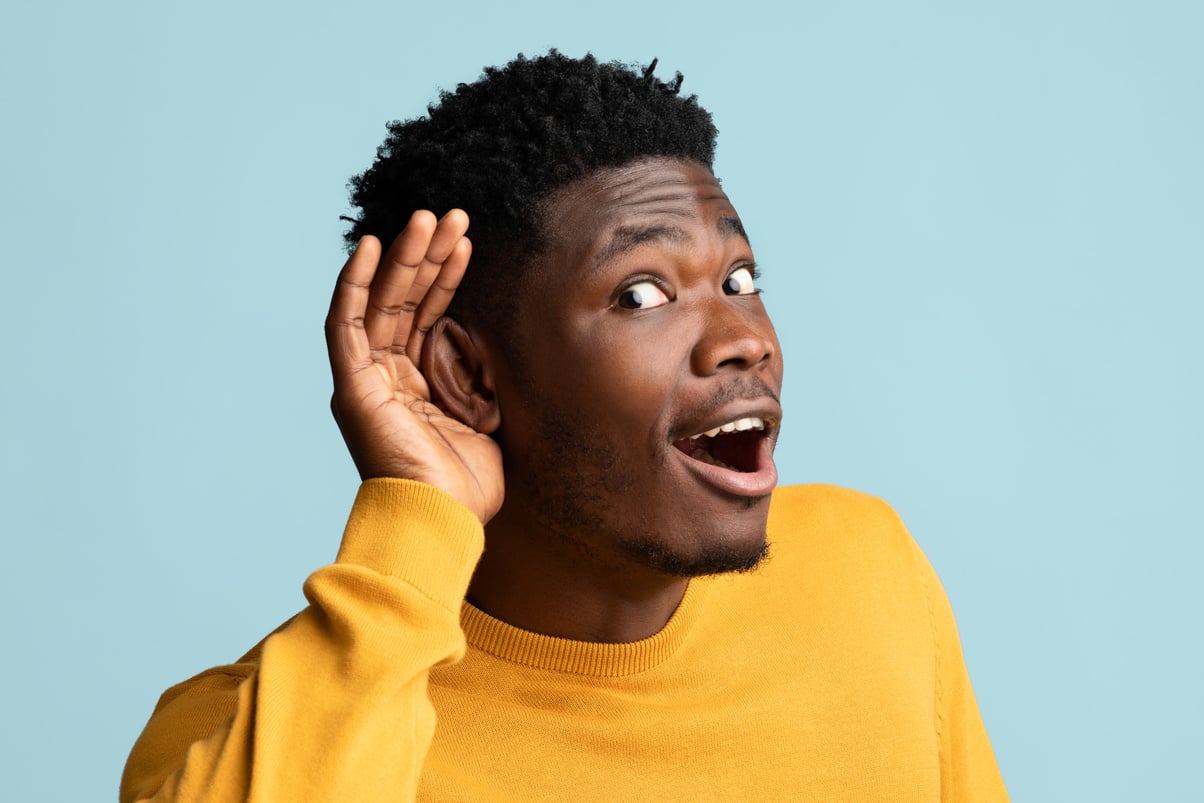 Curious Black Guy Holding Palm by Ear